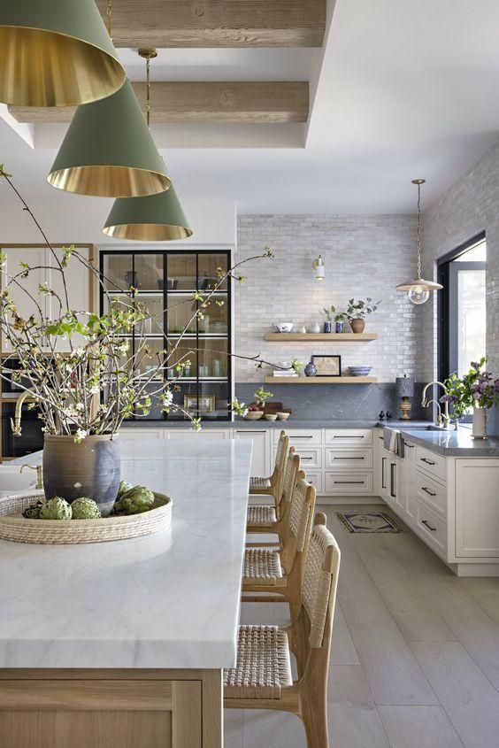 Sage green and gold cone pendant lighting over kitchen island